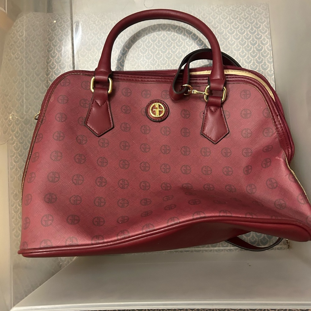 Red Leather Satchel with Structured Design and Gold Hardware